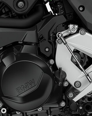 We see a close-up of the two-cylinder in-line engine.