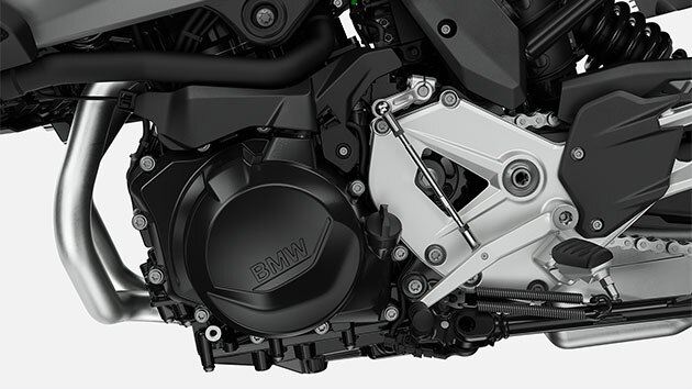 We see a close-up of the two-cylinder in-line engine.