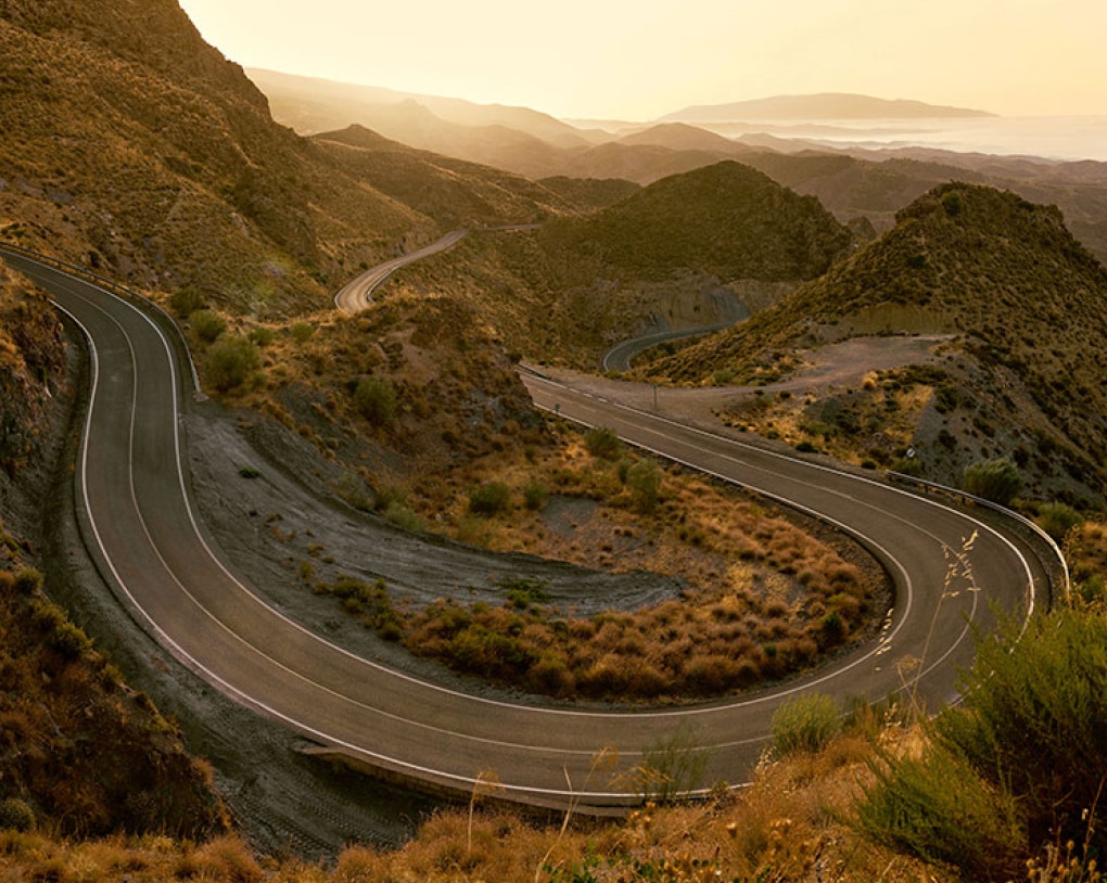 Curvy road in hilly landscape